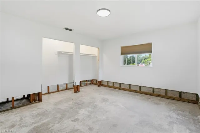 an empty room with windows