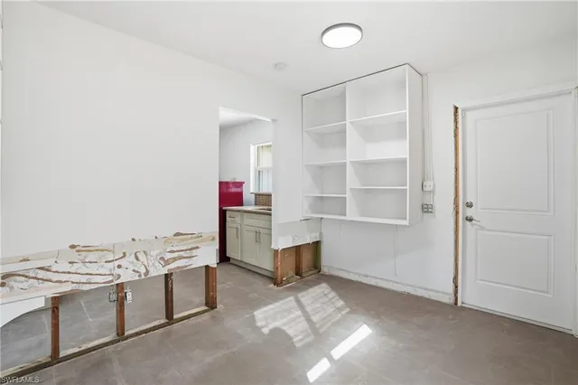 a view of an empty room with a window