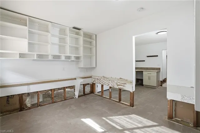 an aerial view of a house with a yard and garden