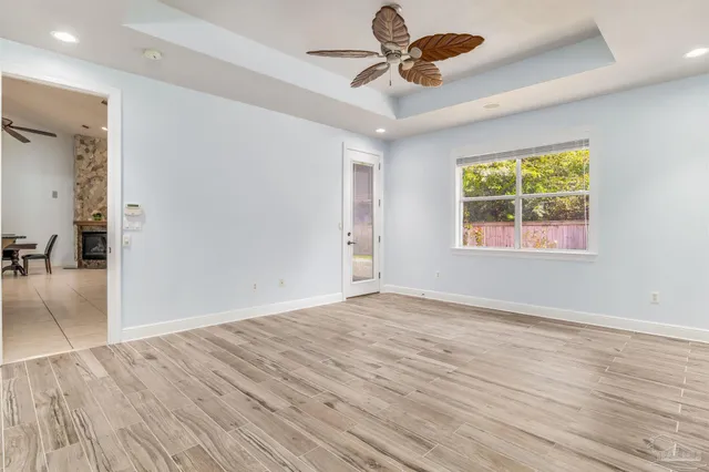 a bathroom with a granite countertop sink a mirror and a shower