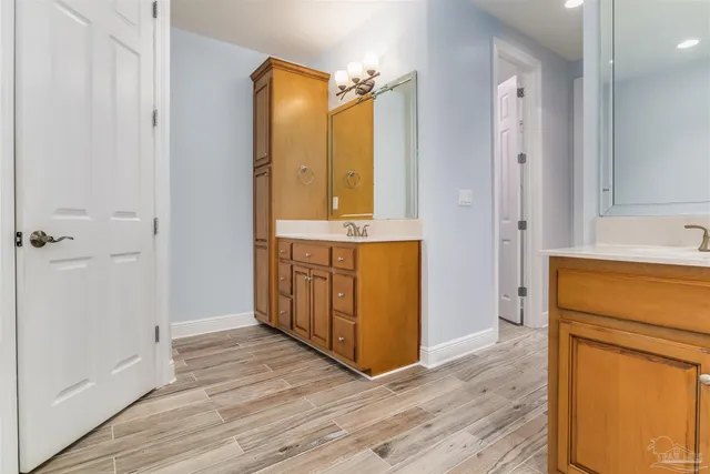 a spacious bathroom with a bathtub and shower