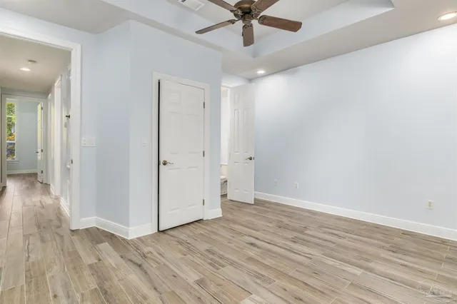 a view of a kitchen with sink and cabinets