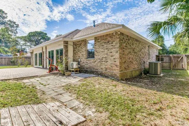 a house with a yard and a large parking space