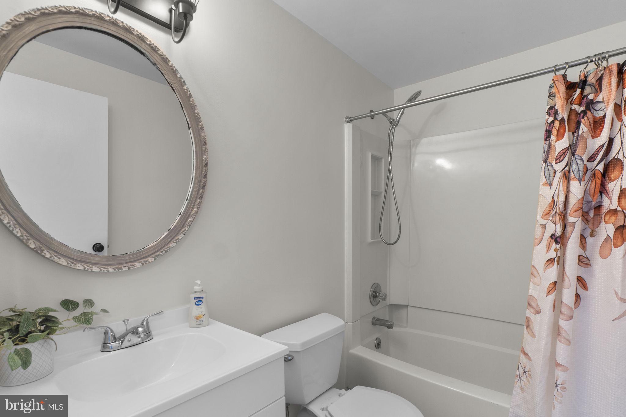 1715 Country Court Frederick, MD 21702 - Photo 15 of 31 a bathroom with a sink a toilet and shower