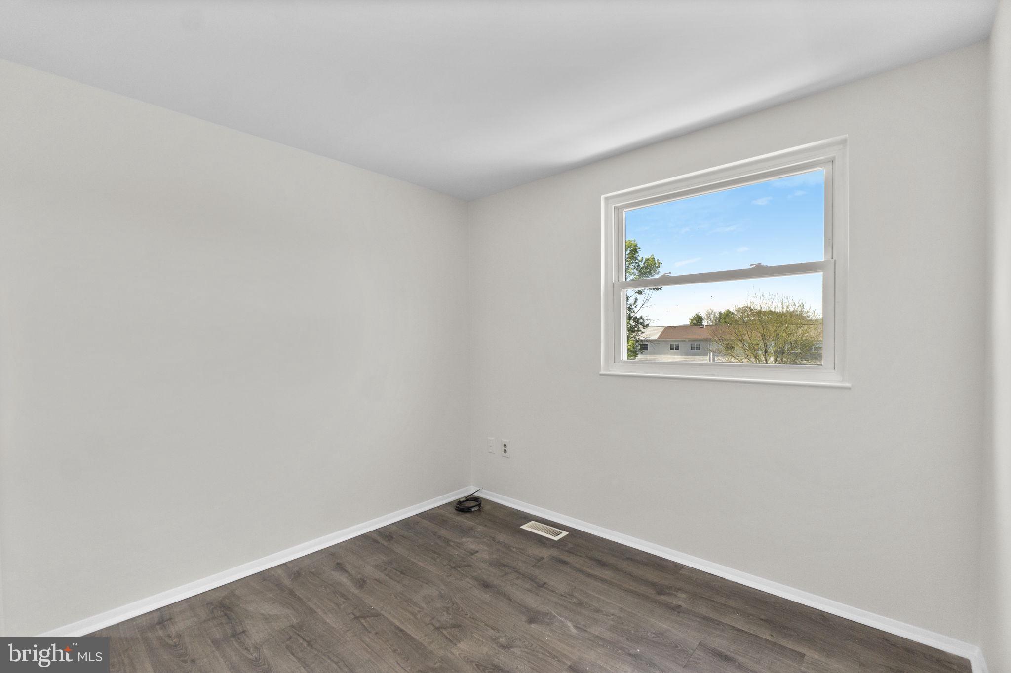 1715 Country Court Frederick, MD 21702 - Photo 16 of 31 an empty room with a window