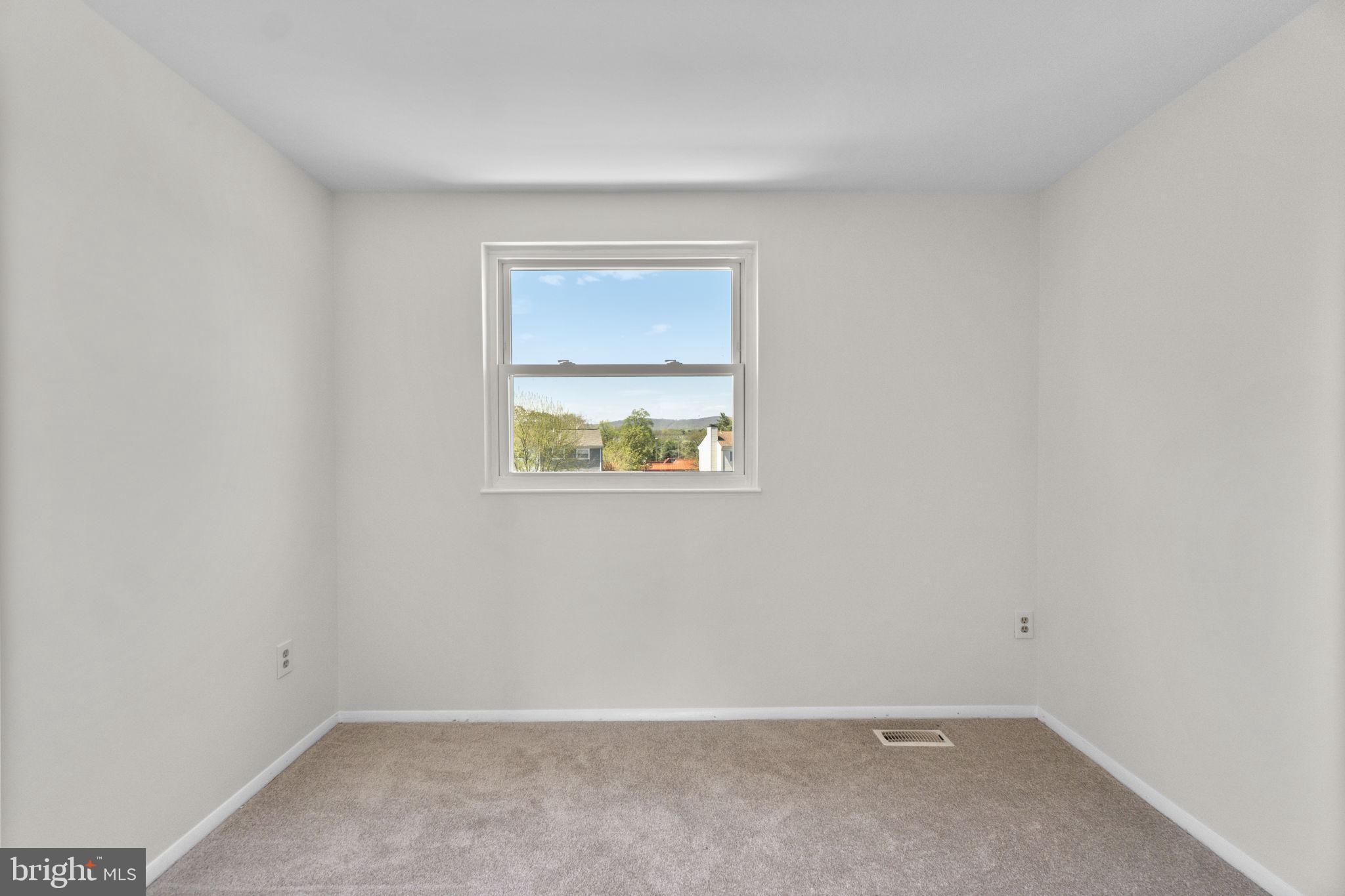 1715 Country Court Frederick, MD 21702 - Photo 18 of 31 an empty room with a window