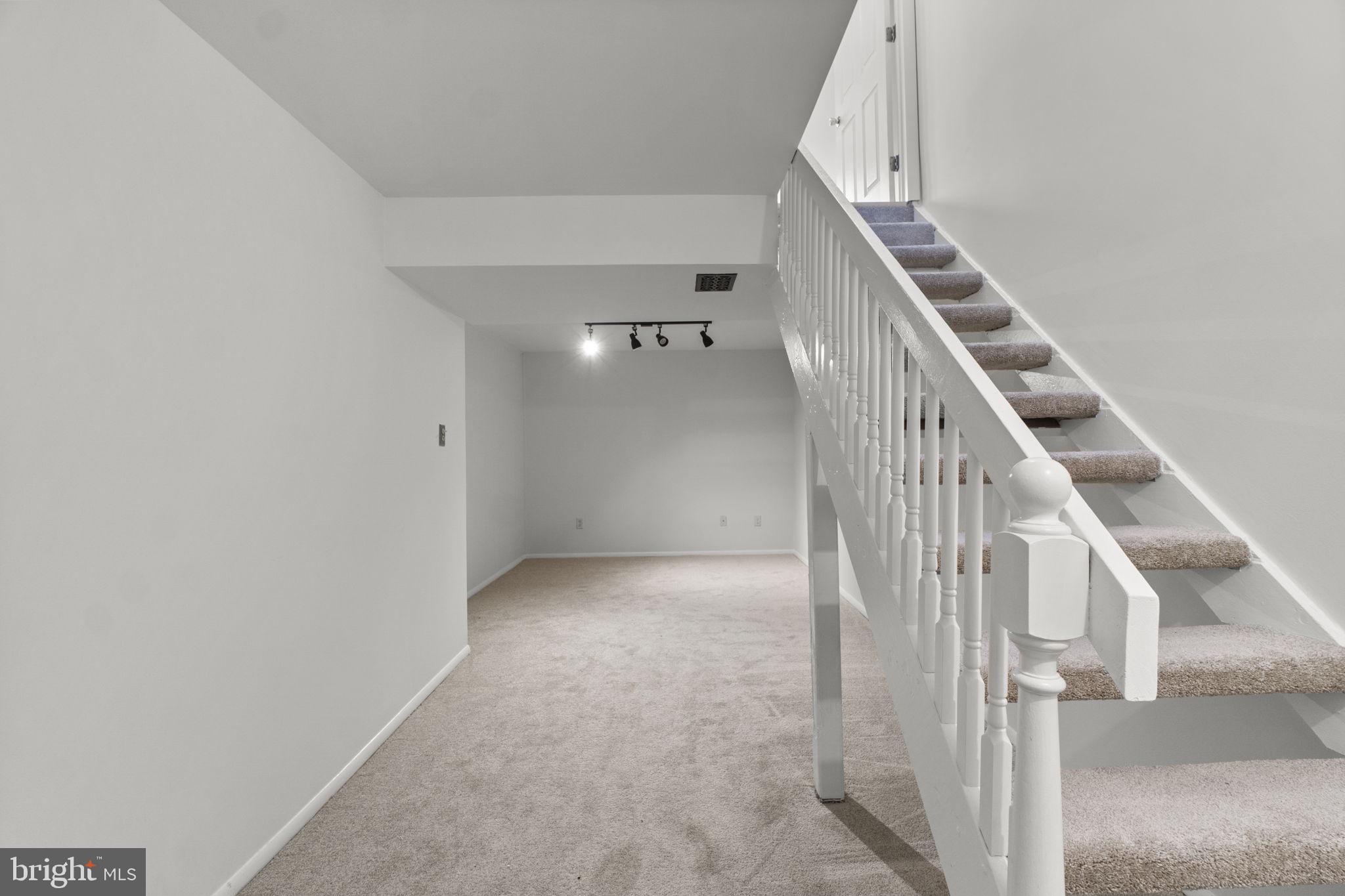 1715 Country Court Frederick, MD 21702 - Photo 20 of 31 a view of a hallway with staircase