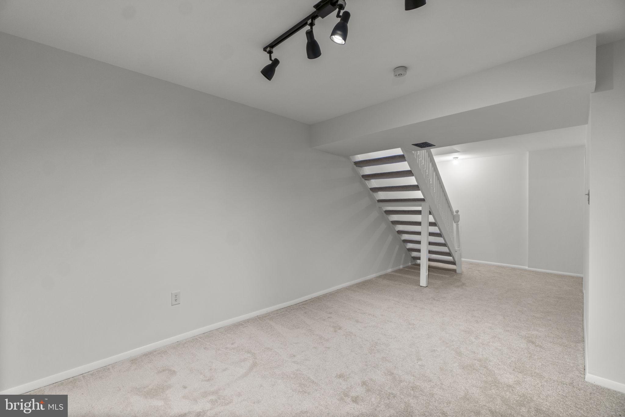 1715 Country Court Frederick, MD 21702 - Photo 21 of 31 a view of an empty room with stairs