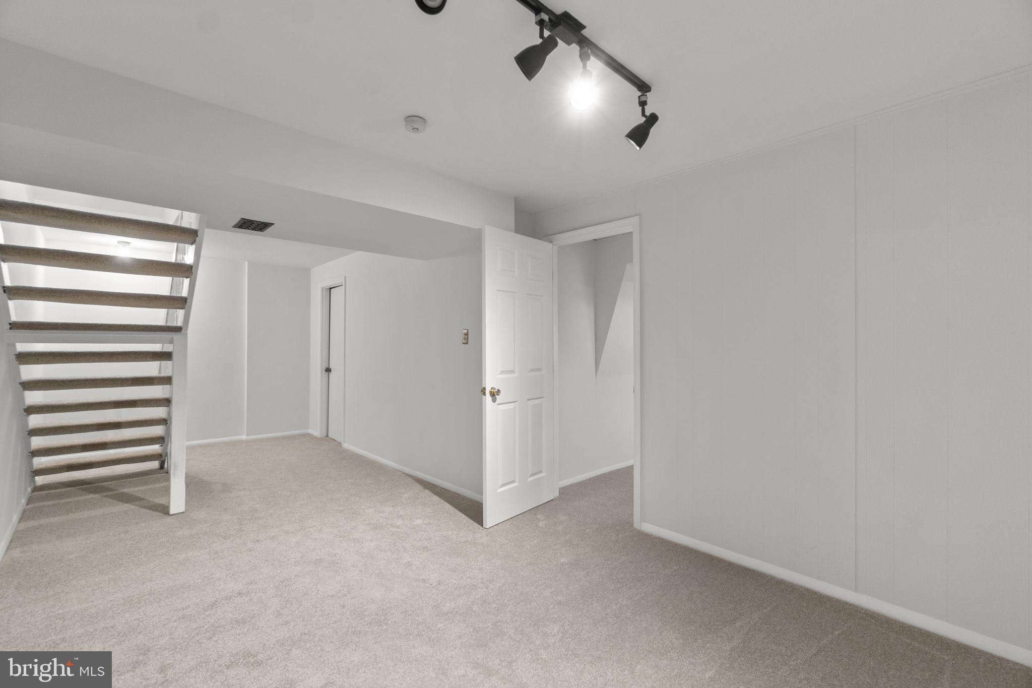 1715 Country Court Frederick, MD 21702 - Photo 22 of 31 a view of an empty room with a window