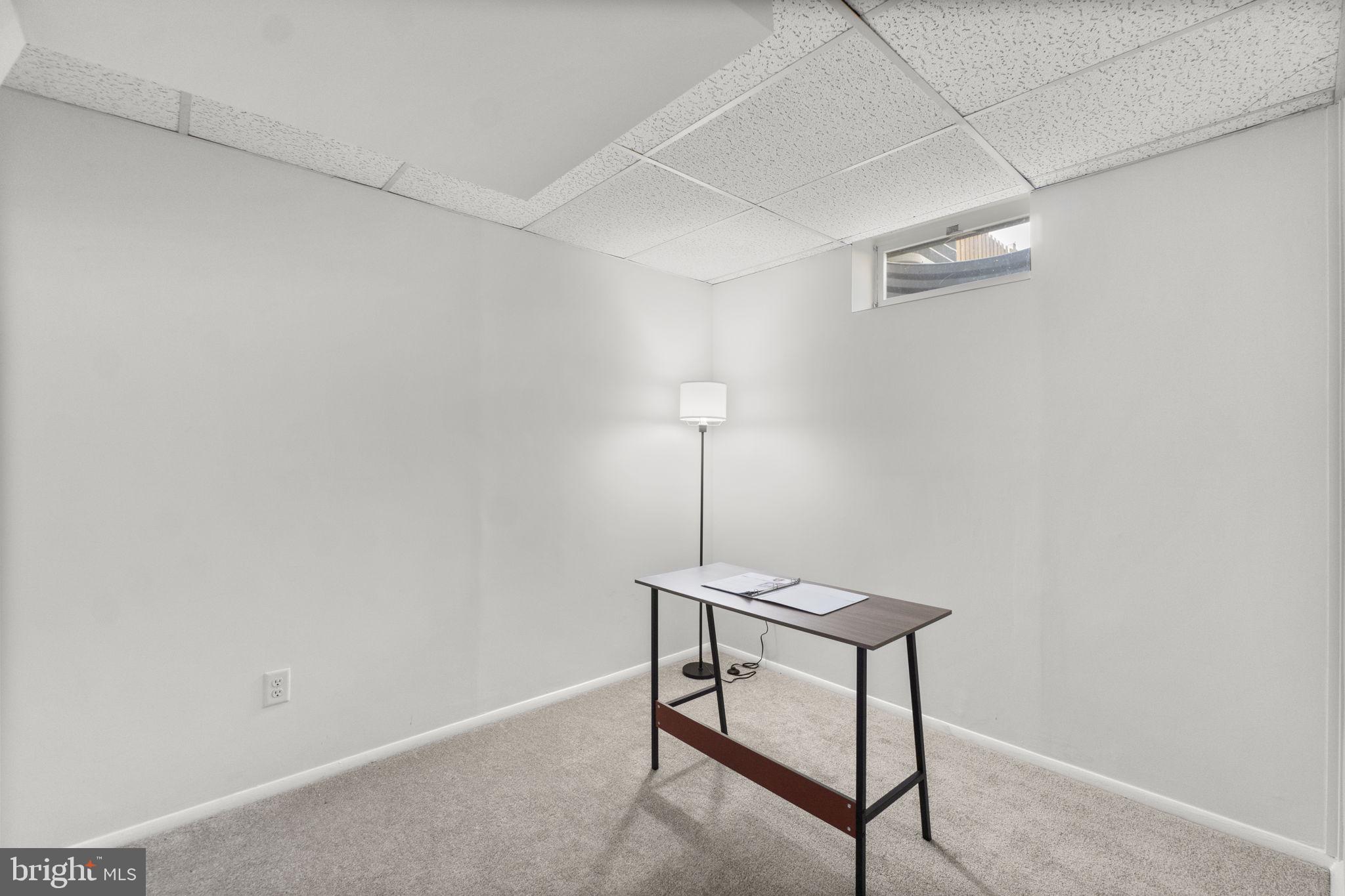 1715 Country Court Frederick, MD 21702 - Photo 23 of 31 a view of a room with a table and chairs