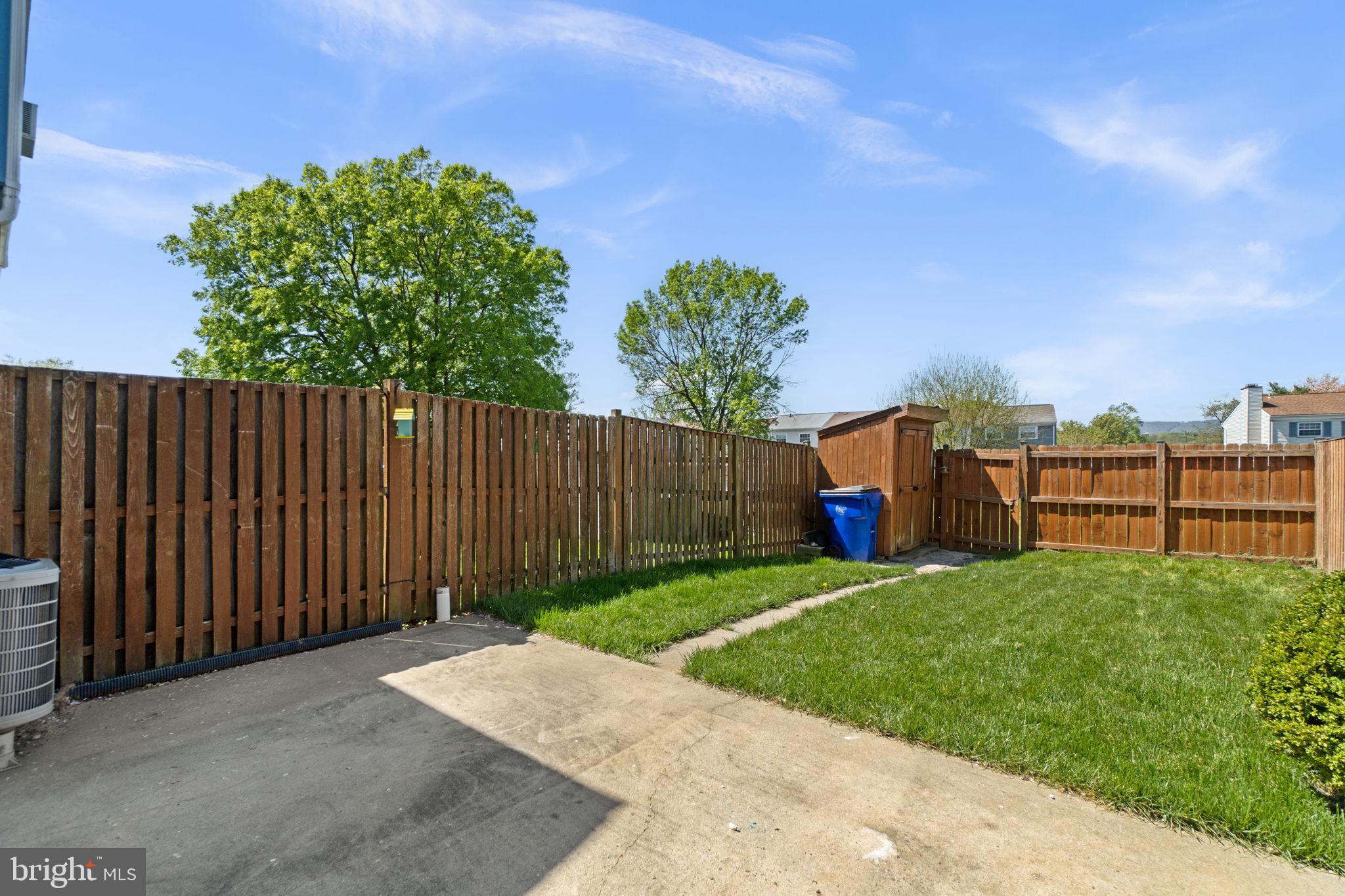 1715 Country Court Frederick, MD 21702 - Photo 27 of 31 a view of a backyard with a tree