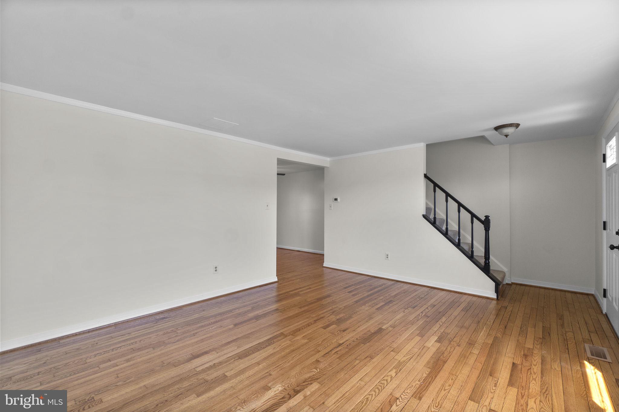 1715 Country Court Frederick, MD 21702 - Photo 4 of 31 a view of an empty room with wooden floor