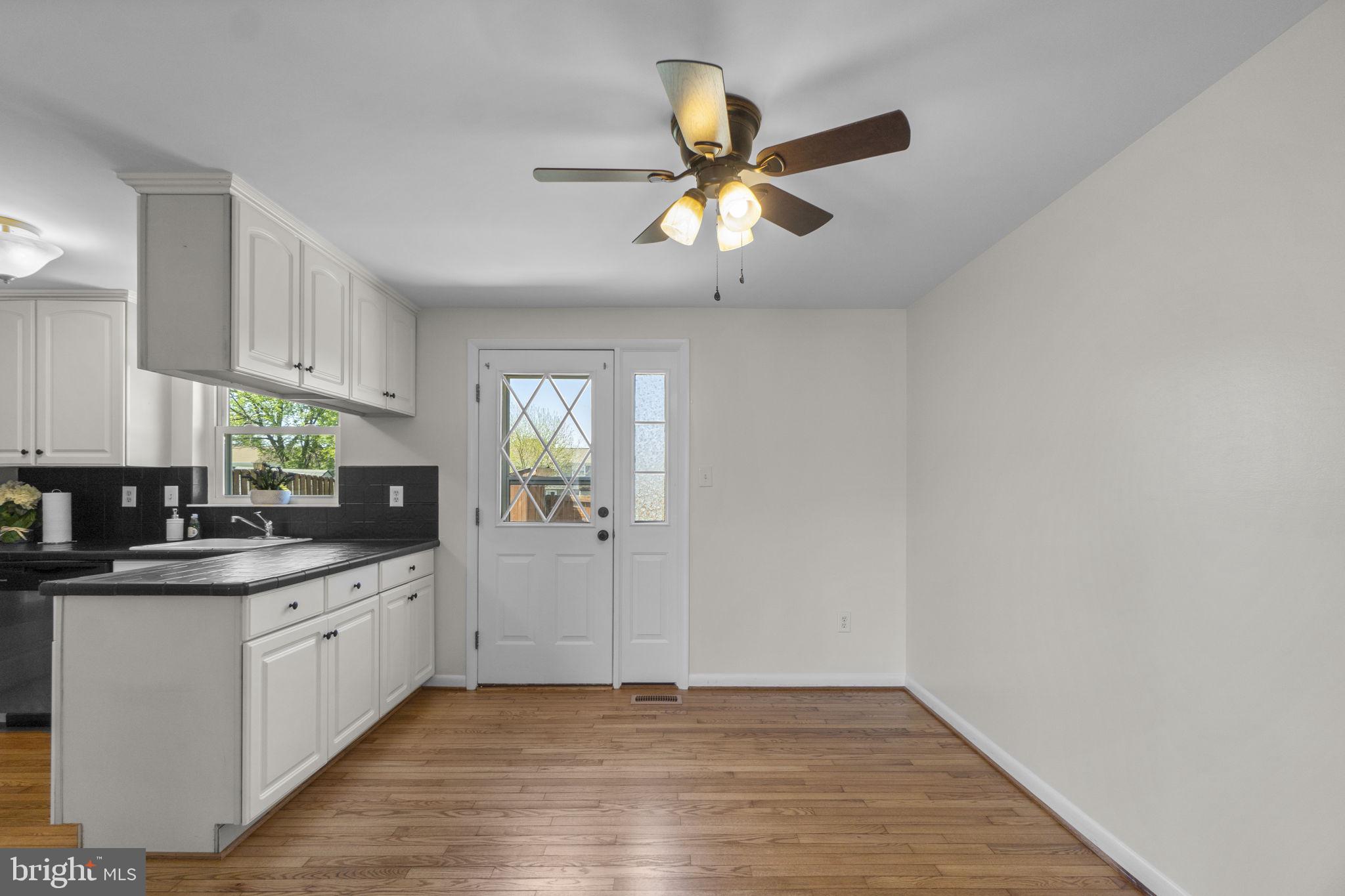 1715 Country Court Frederick, MD 21702 - Photo 6 of 31 a kitchen with a sink cabinets and window
