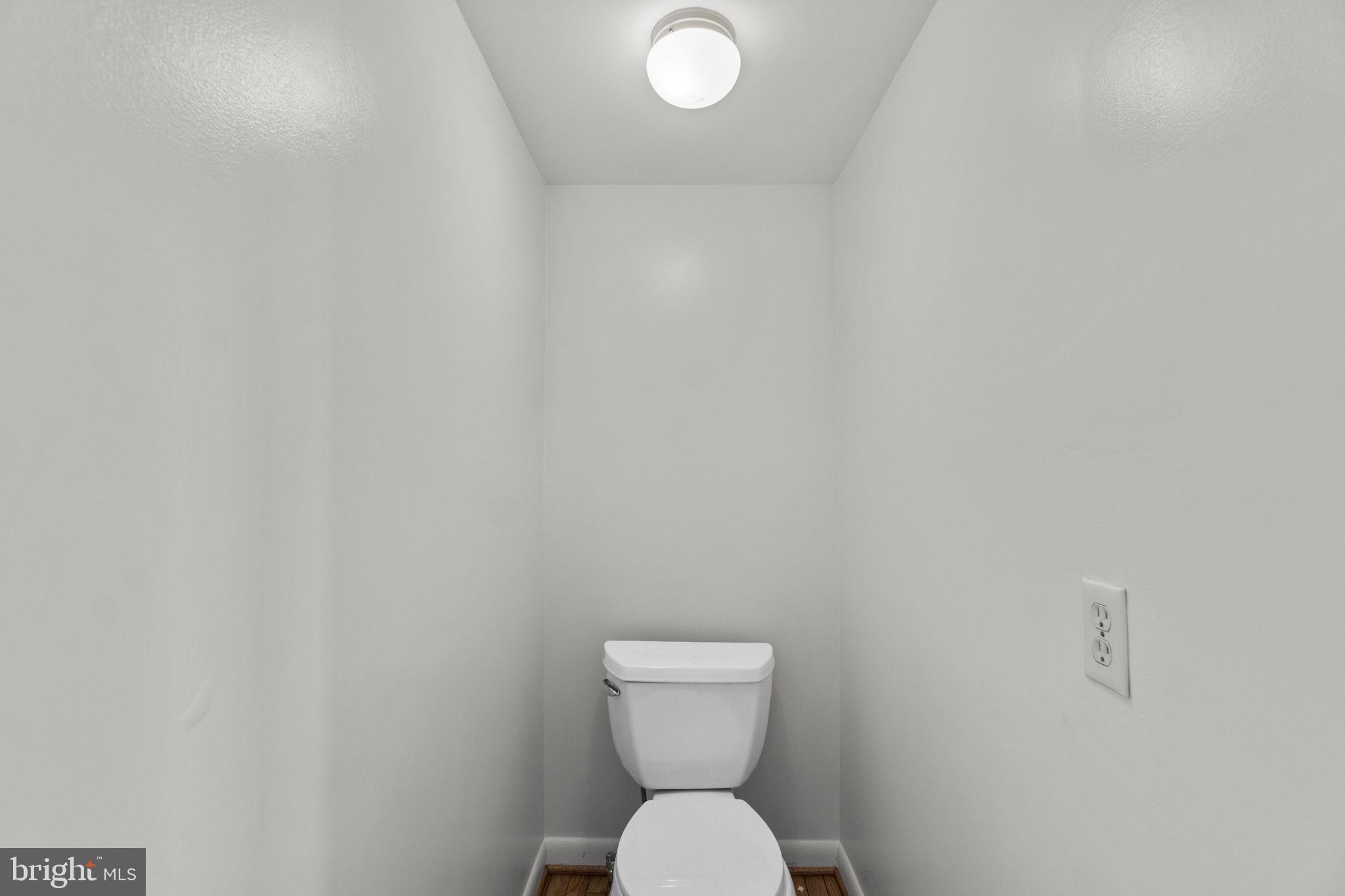 1715 Country Court Frederick, MD 21702 - Photo 10 of 31 a bathroom with a toilet and a sink
