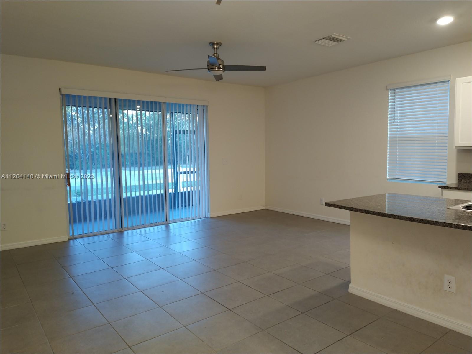 8749 Falling Blue Place Riverview, FL 33578 - Photo 11 of 51 a view of an empty room with a window