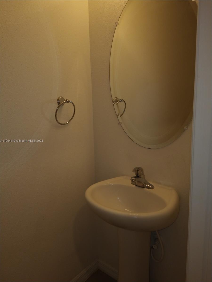 8749 Falling Blue Place Riverview, FL 33578 - Photo 14 of 51 a bathroom with a sink and mirror