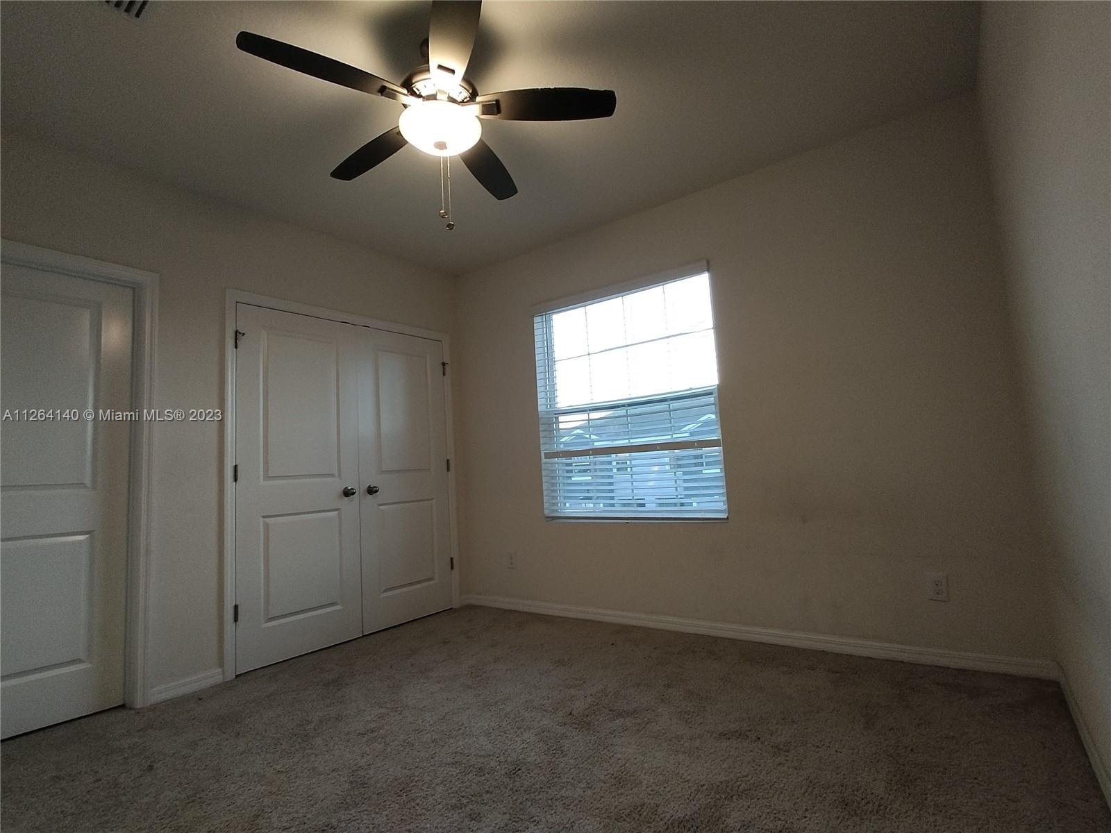 8749 Falling Blue Place Riverview, FL 33578 - Photo 22 of 51 a view of an empty room with a window