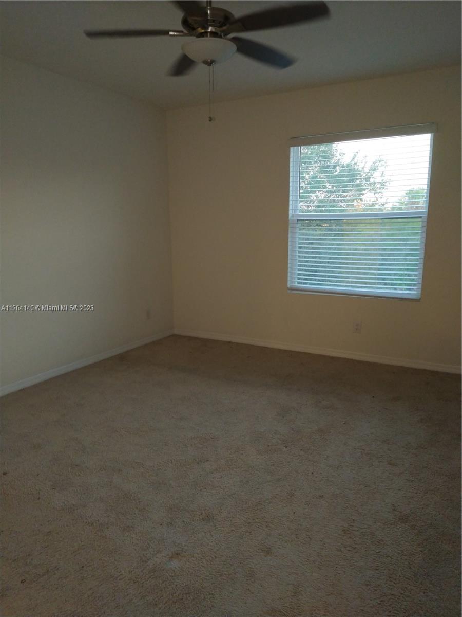 8749 Falling Blue Place Riverview, FL 33578 - Photo 30 of 51 an empty room with a window