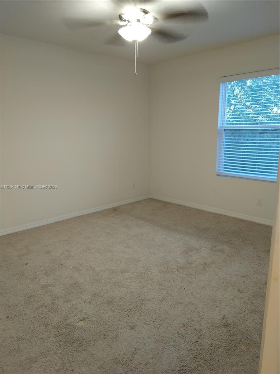 8749 Falling Blue Place Riverview, FL 33578 - Photo 35 of 51 en empty room with a window
