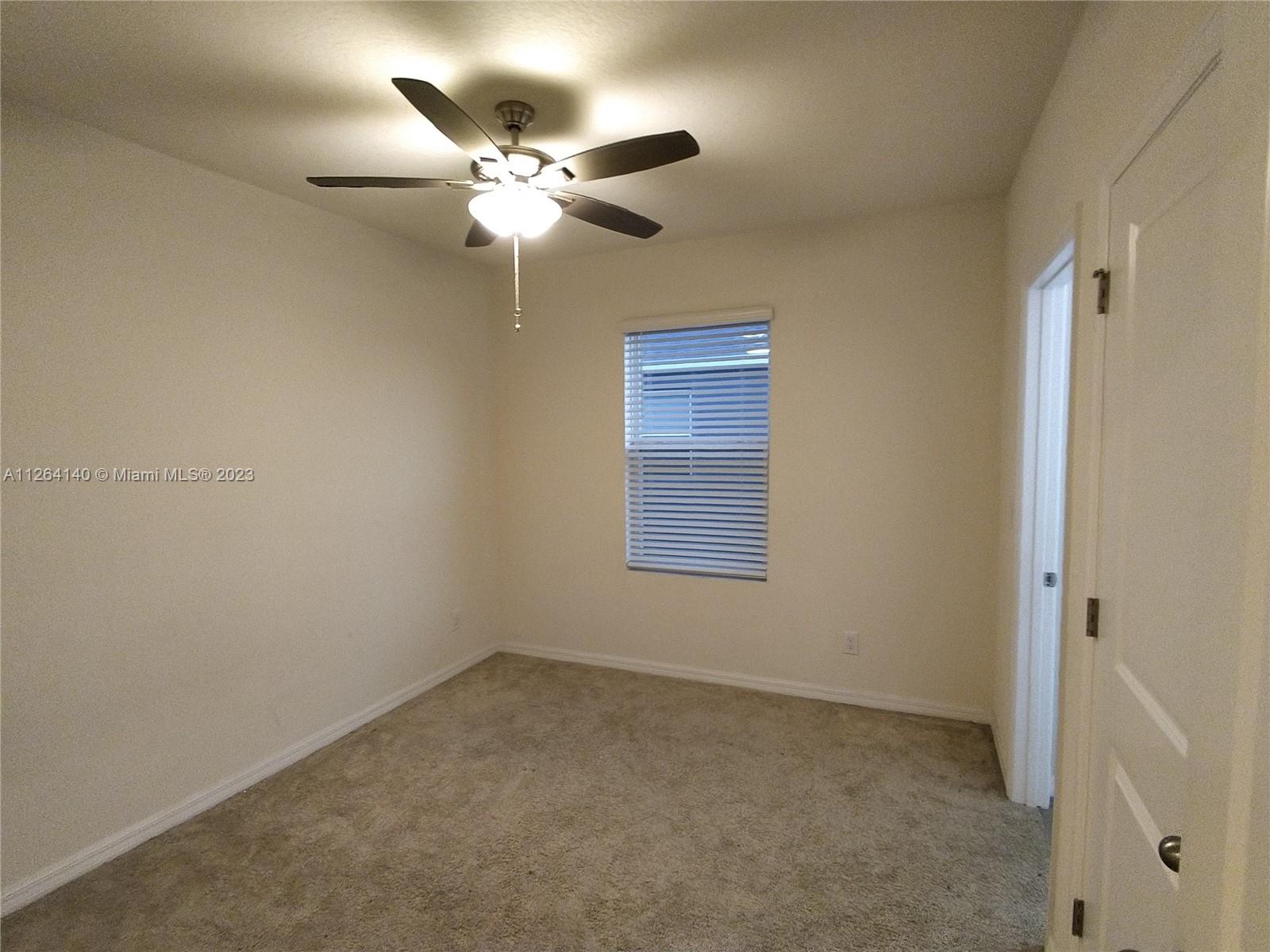8749 Falling Blue Place Riverview, FL 33578 - Photo 36 of 51 a view of an empty room with a fan