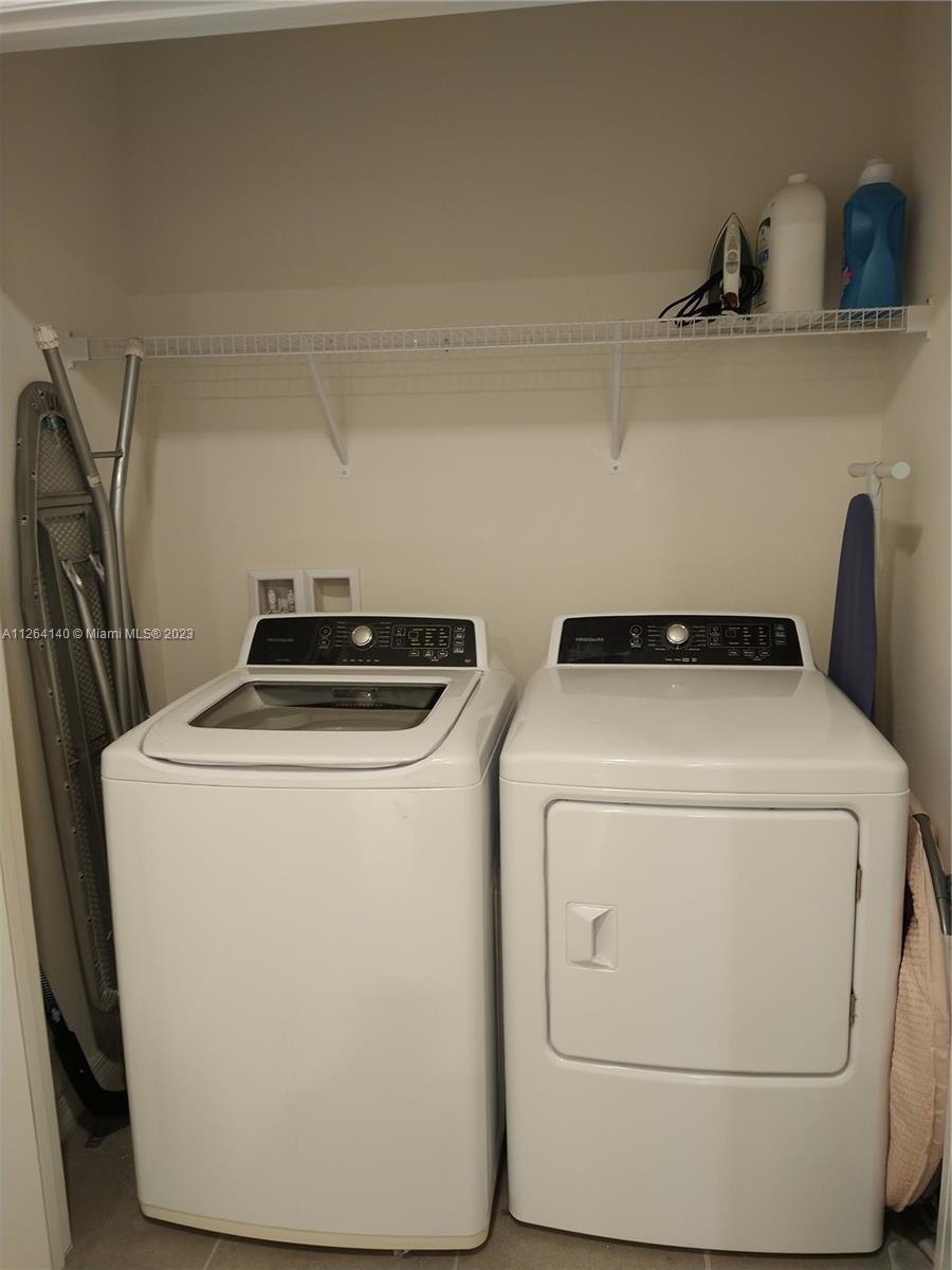 8749 Falling Blue Place Riverview, FL 33578 - Photo 40 of 51 a utility room with dryer and washer