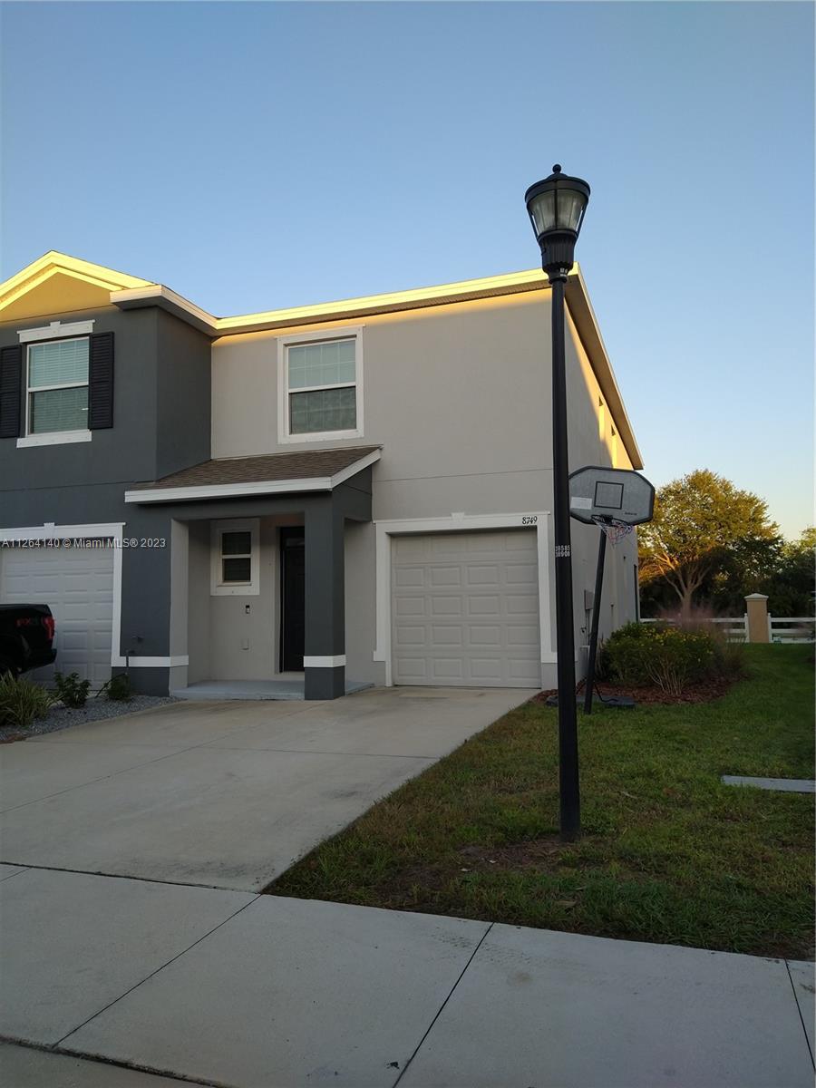 8749 Falling Blue Place Riverview, FL 33578 - Photo 4 of 51 a front view of a house with garden