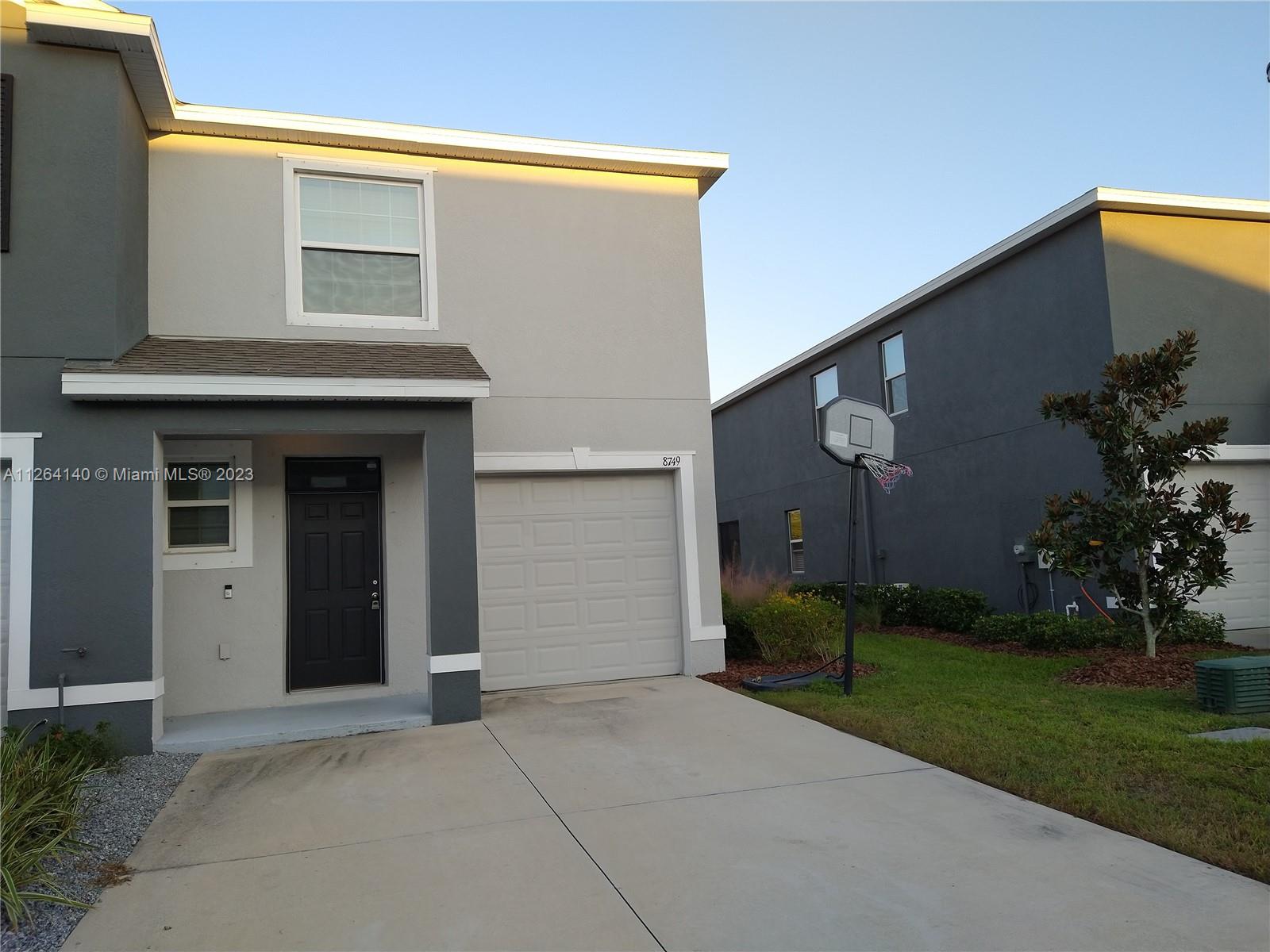 8749 Falling Blue Place Riverview, FL 33578 - Photo 6 of 51 a view of a house with backyard and garden