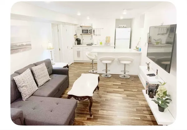 a living room with furniture and a table
