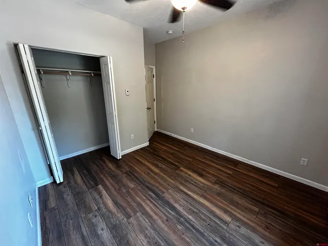an empty room with wooden floor