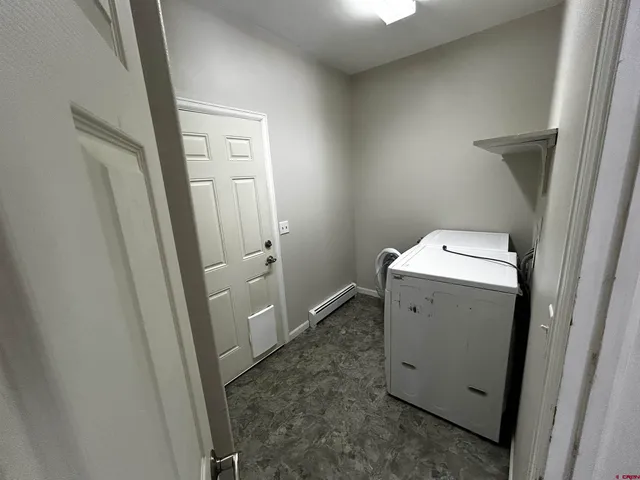 a utility room with closet door
