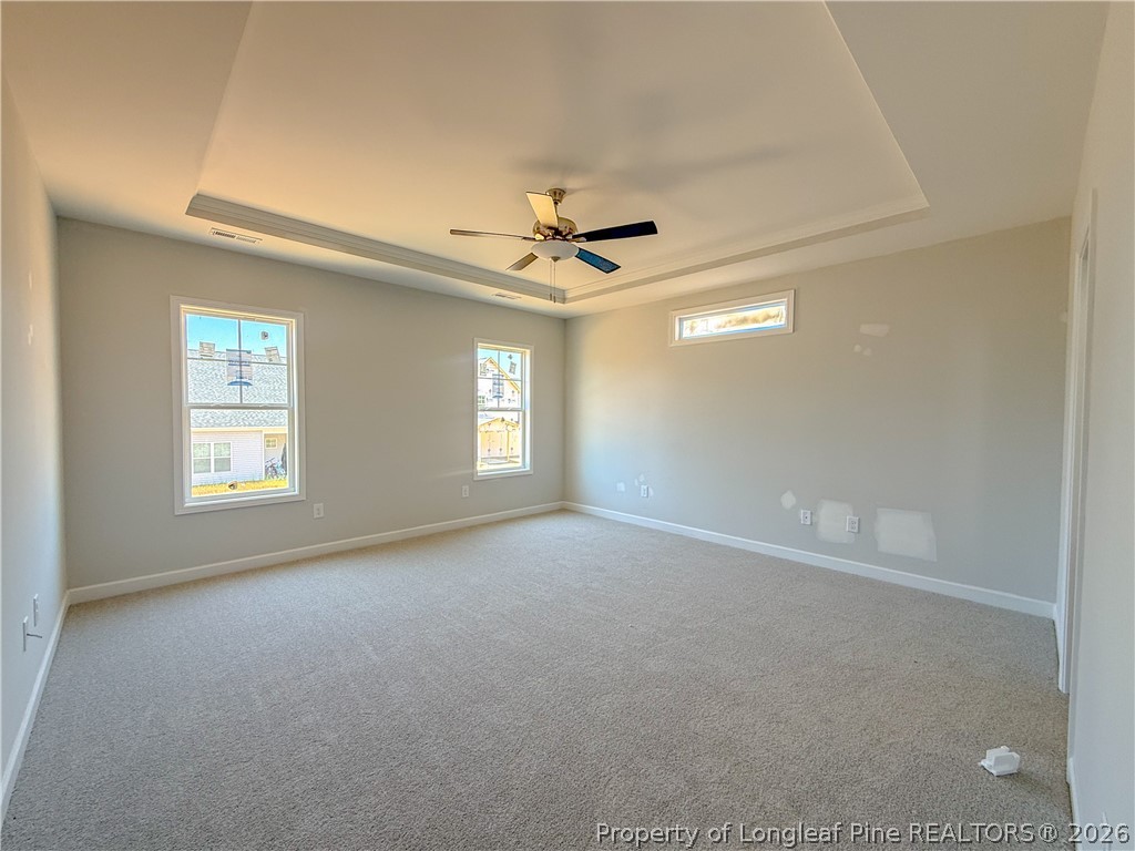 809 Union Street Raeford, NC 28376 - Photo 5 of 9 an empty room with windows and fan