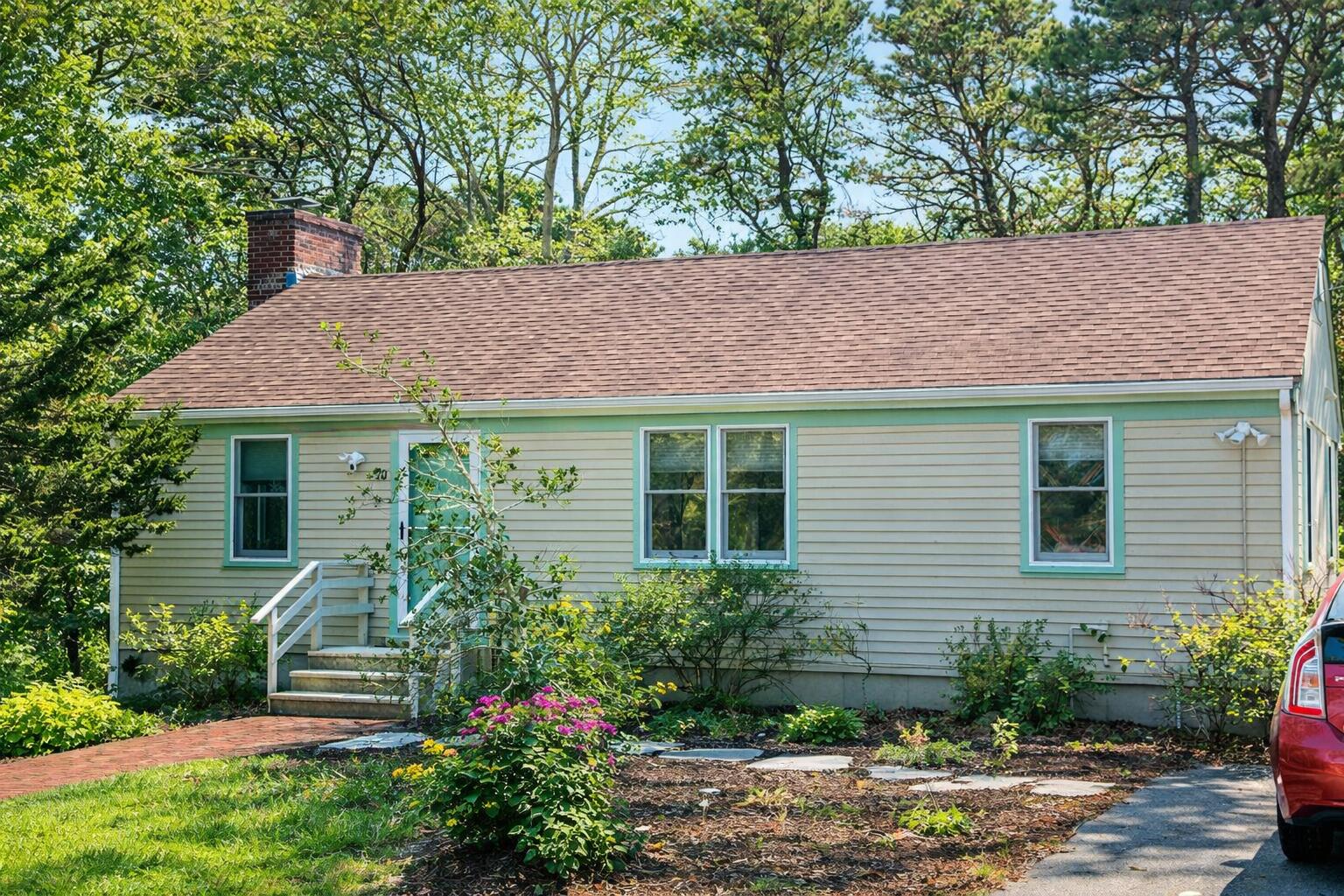 20 Stone Court Eastham, MA 02642 - Photo 1 of 31 a front view of a house with a yard