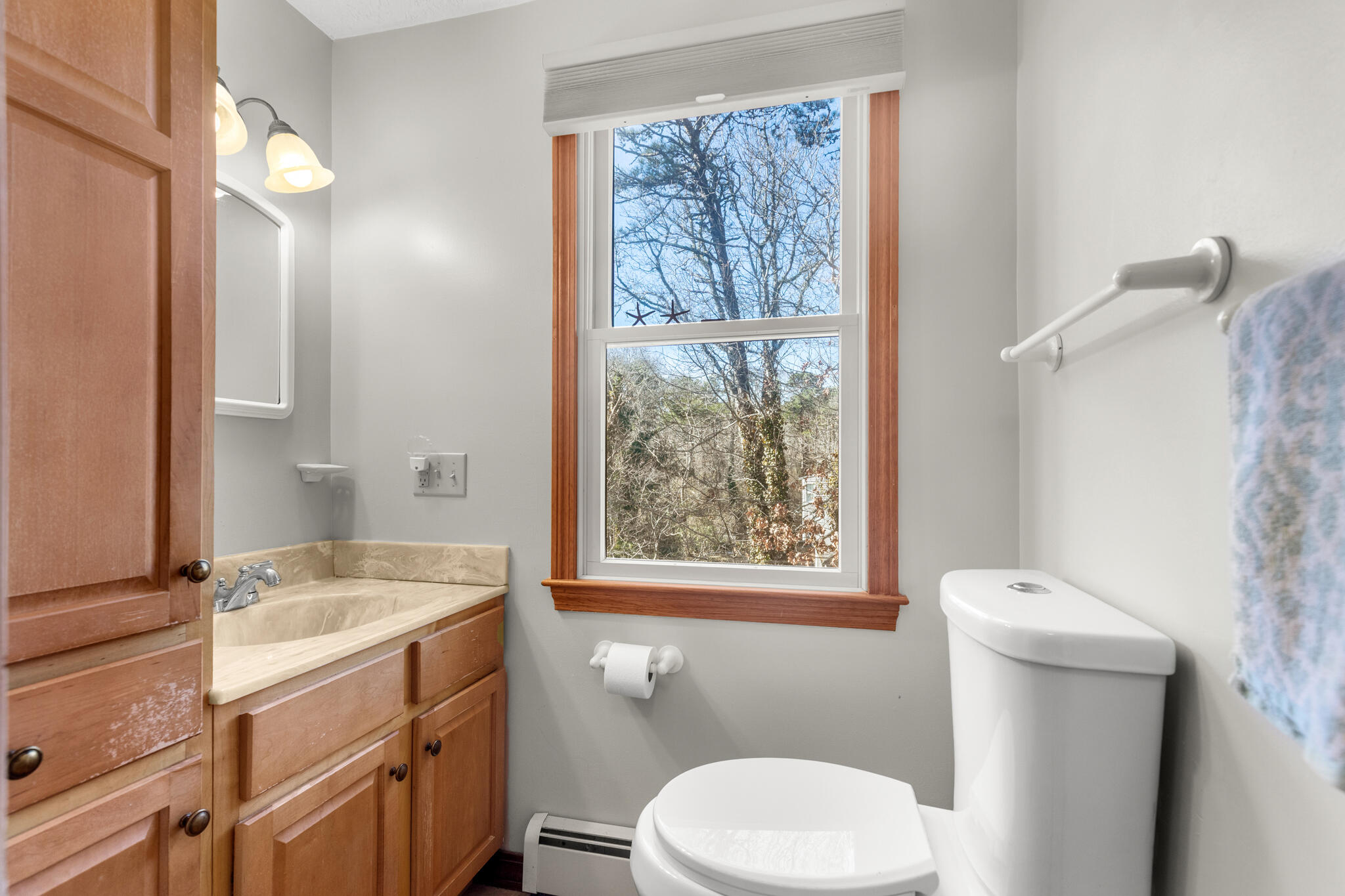 20 Stone Court Eastham, MA 02642 - Photo 18 of 31 a bathroom with a sink toilet and window