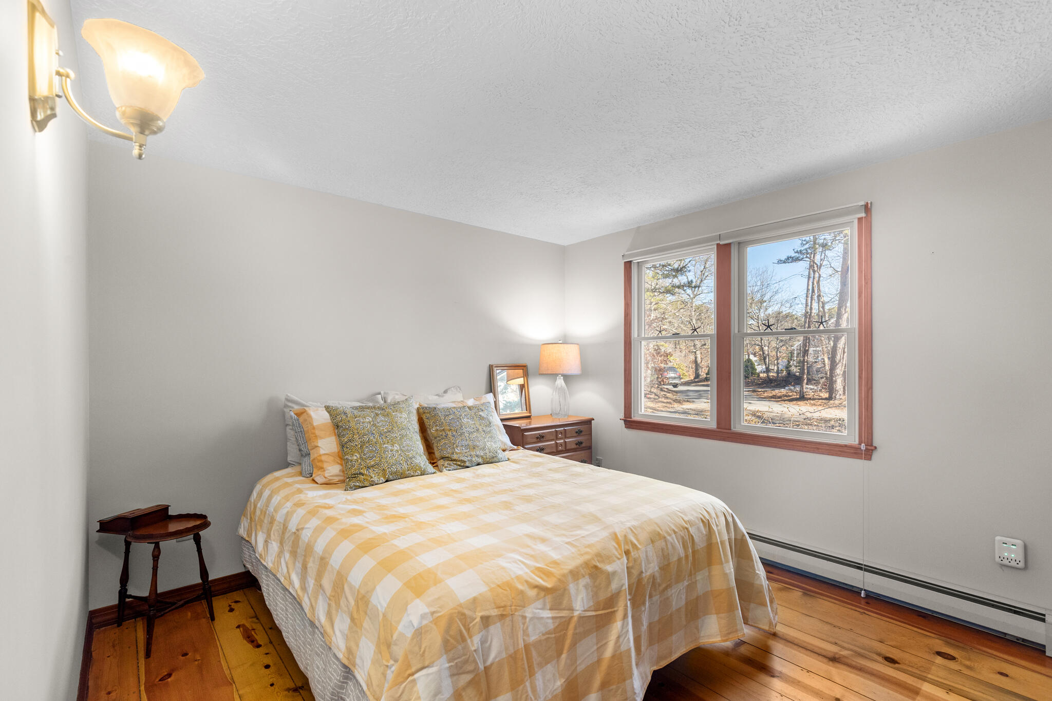 20 Stone Court Eastham, MA 02642 - Photo 20 of 31 a bedroom with a bed and a lamp