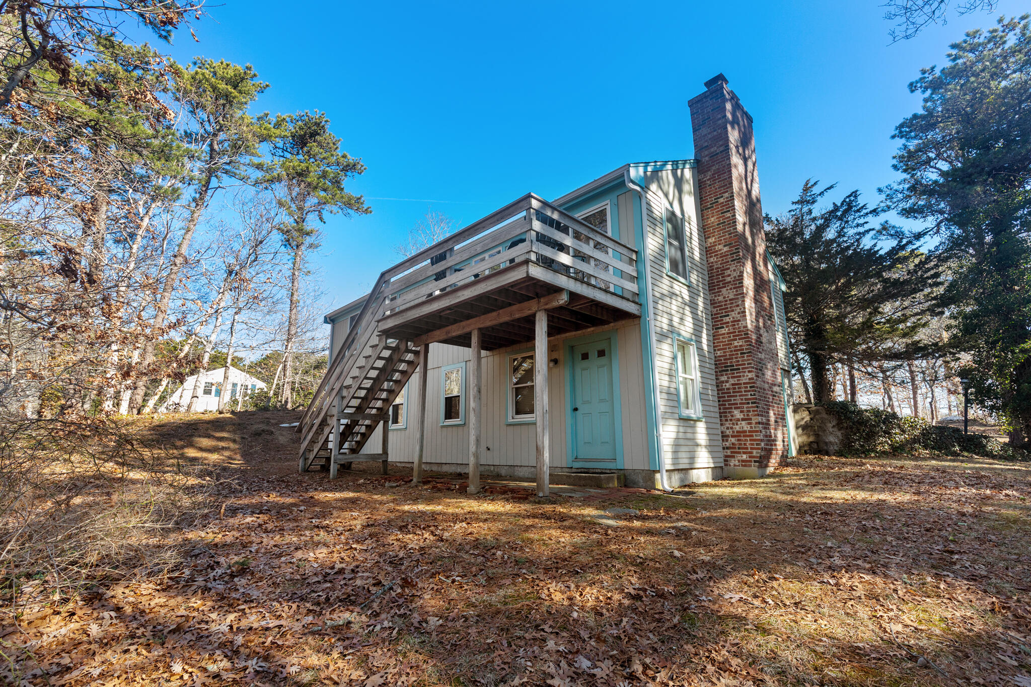 20 Stone Court Eastham, MA 02642 - Photo 4 of 31 a front view of a house with a yard