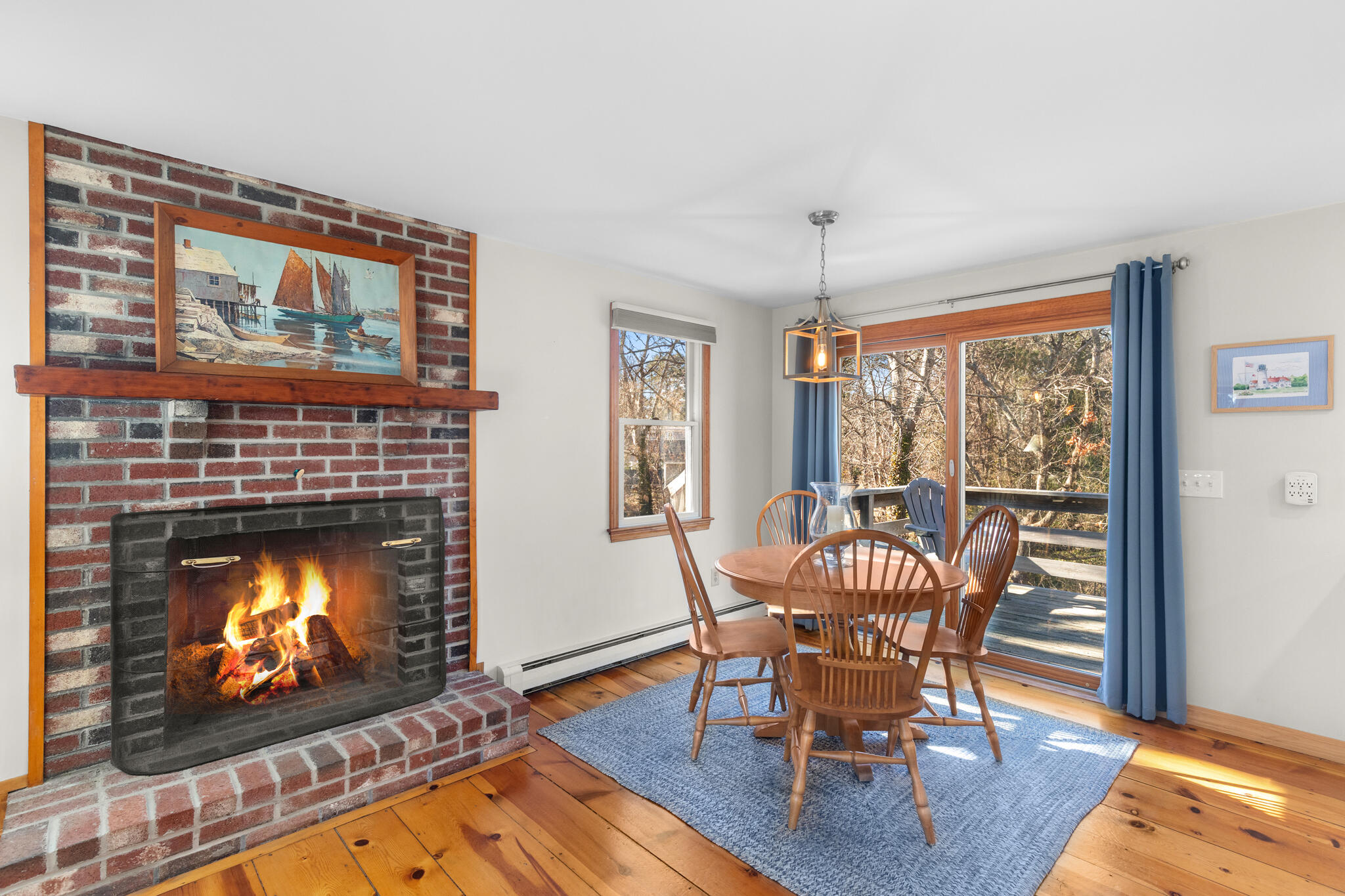 20 Stone Court Eastham, MA 02642 - Photo 8 of 31 a dining room with furniture a fireplace and wooden floor