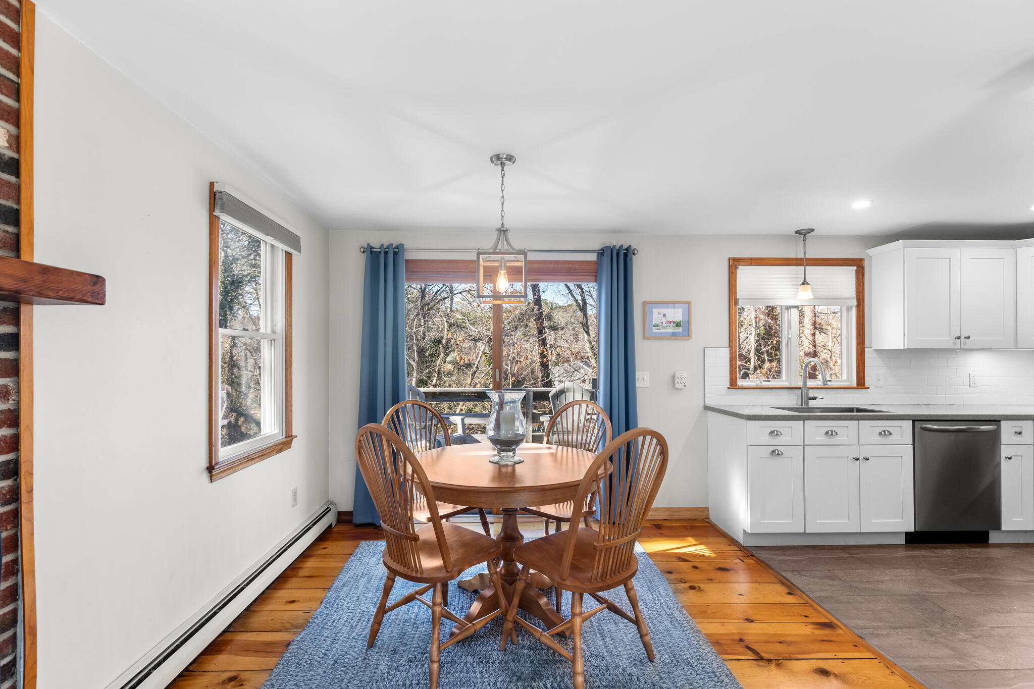 20 Stone Court Eastham, MA 02642 - Photo 10 of 31 a dining room with furniture a chandelier and wooden floor