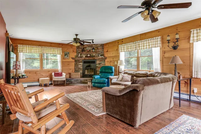 a balcony with furniture and garden view