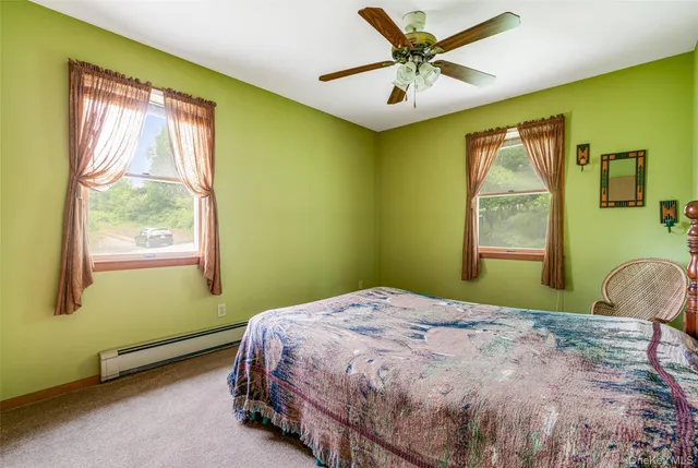 a bedroom with bed and window
