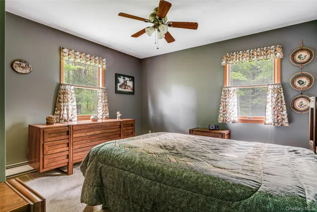 a bedroom with two beds and a window