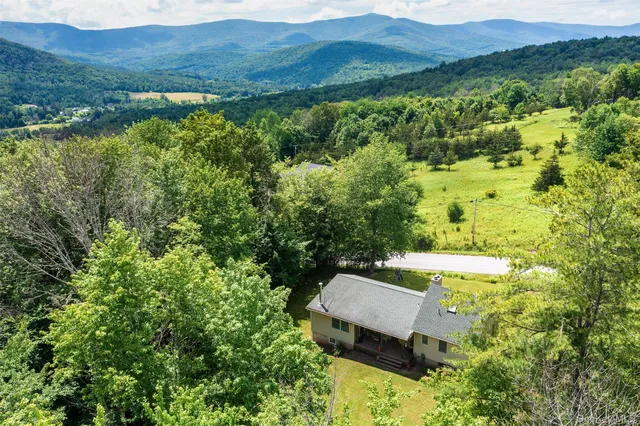 a kitchen with sink refrigerator and stove