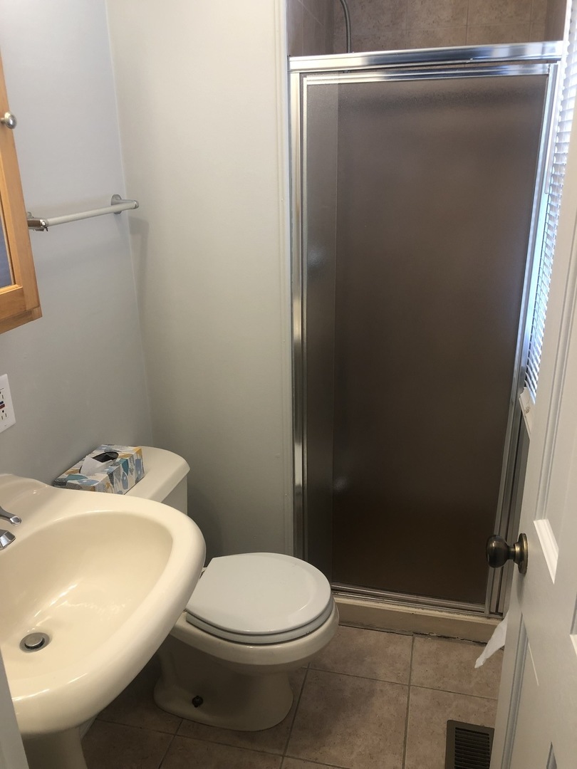 167 Thornhurst Road Bolingbrook, IL 60440 - Photo 14 of 20 a white toilet sitting next to a bathroom sink