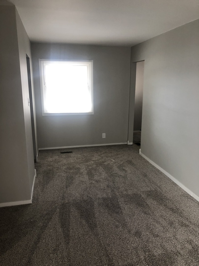 167 Thornhurst Road Bolingbrook, IL 60440 - Photo 3 of 20 an empty room with windows