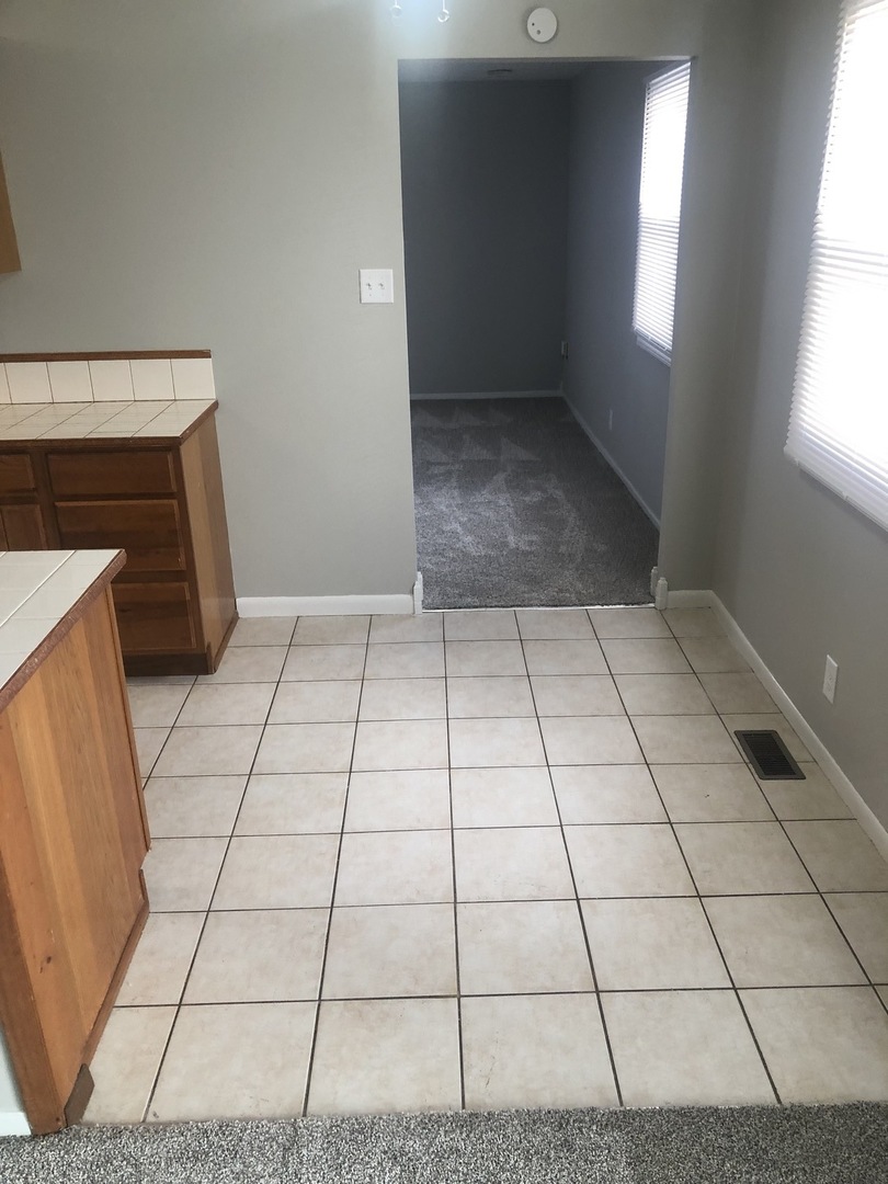 167 Thornhurst Road Bolingbrook, IL 60440 - Photo 6 of 20 a view of an empty room and window