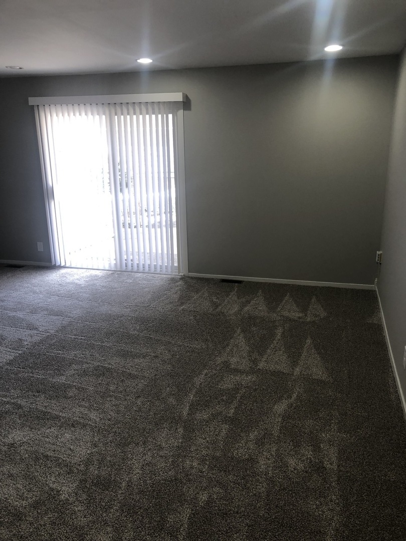 167 Thornhurst Road Bolingbrook, IL 60440 - Photo 9 of 20 an empty room with windows