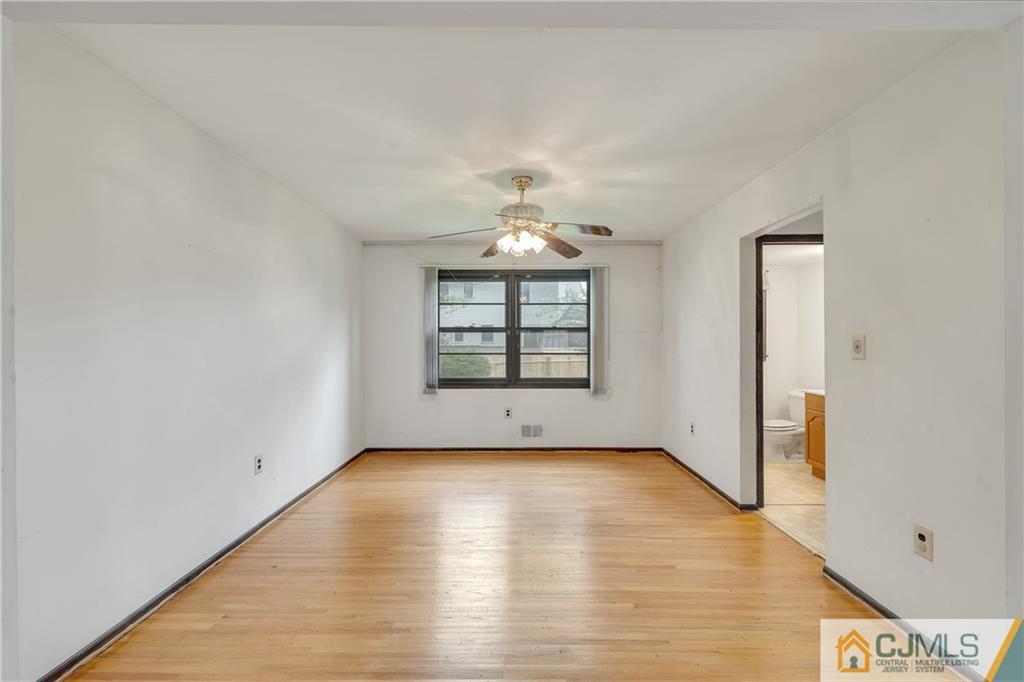 65 Dellwood Road Edison, NJ 08820 - Photo 8 of 24 a view of an empty room with a window