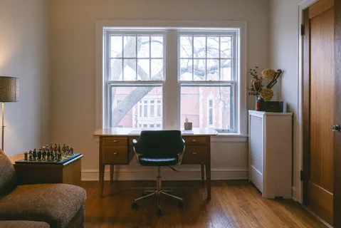 a living room with furniture and a window