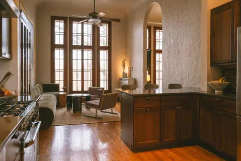 a living room with furniture windows and a flat screen tv