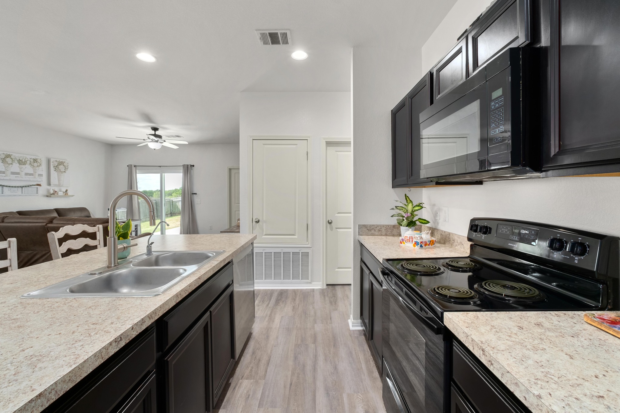 420 Seneca Loop Kyle, TX 78640 - Photo 9 of 26 Open view from kitchen to family room