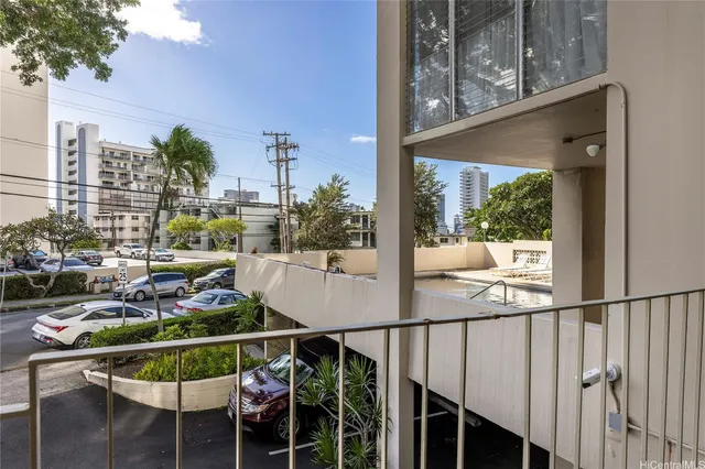 a view of balcony with chairs and potted plant